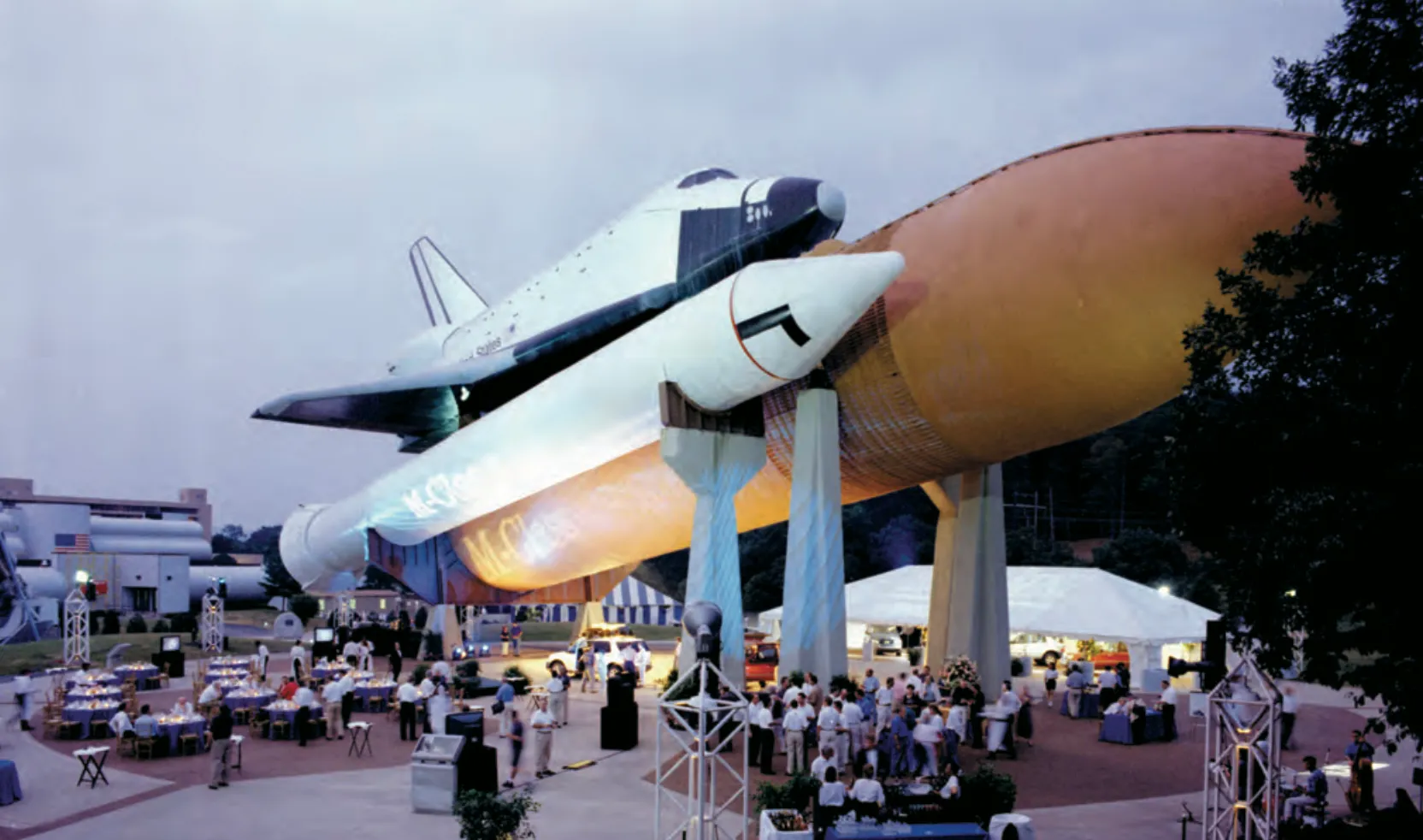 An evening reception set up beneath the Space Shuttle stack at dusk
